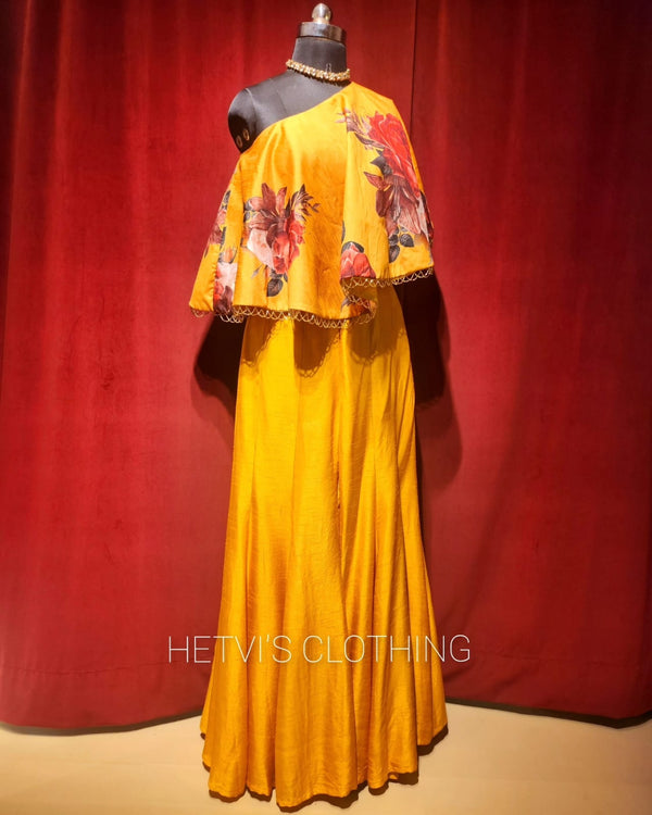 Yellow printed one shoulder cape and flared pants