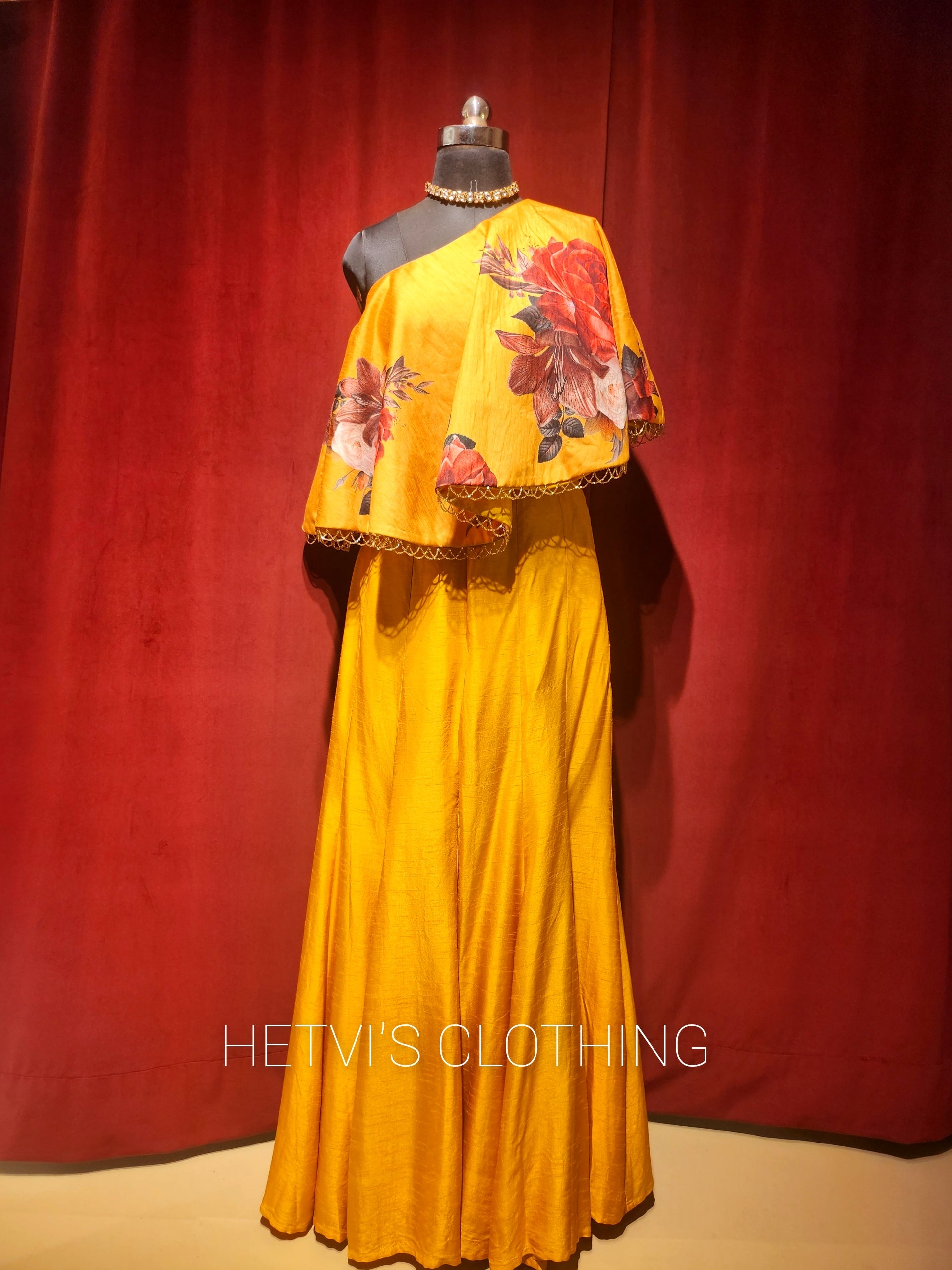 Yellow printed one shoulder cape and flared pants