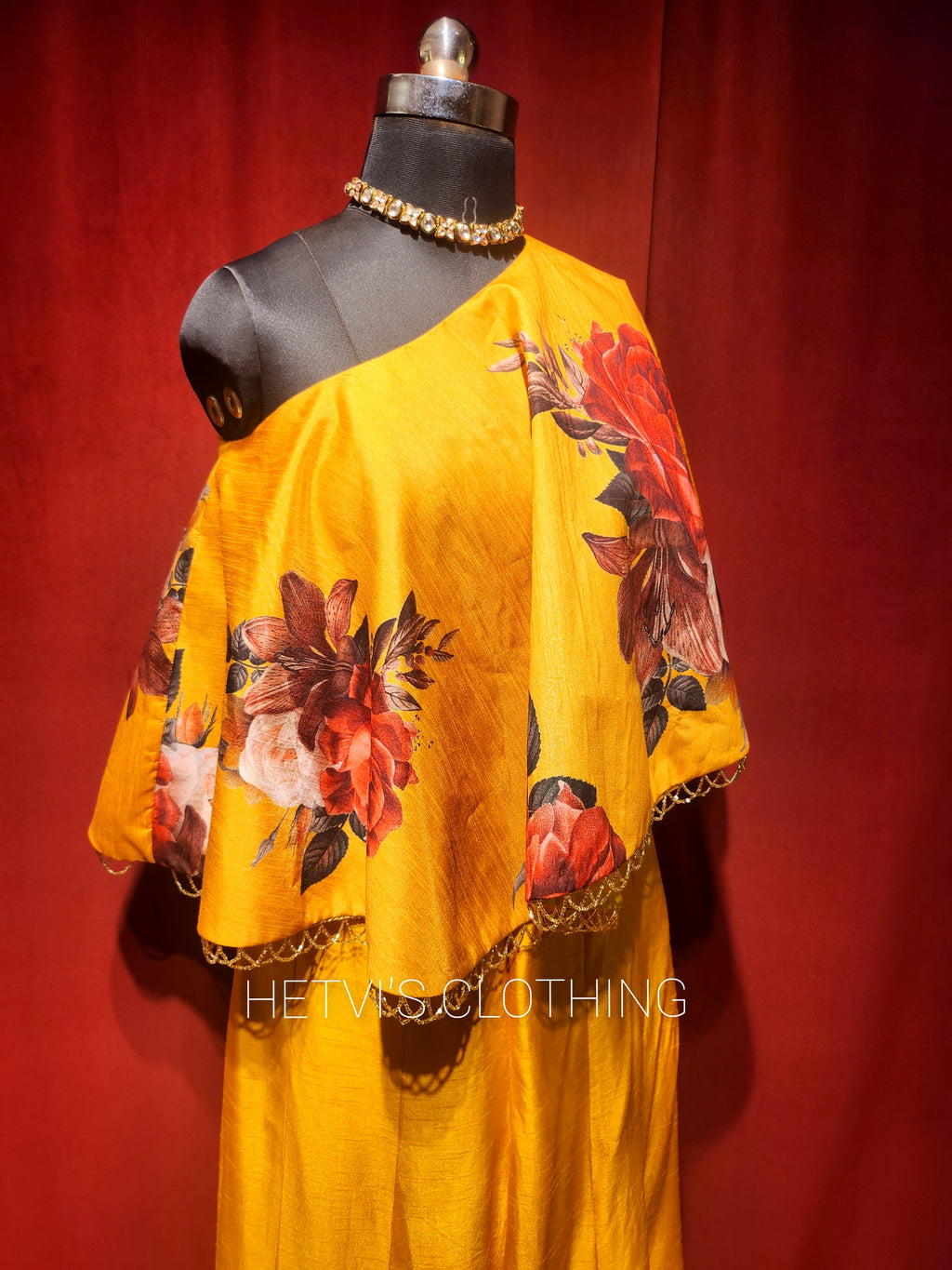 Yellow printed one shoulder cape and flared pants