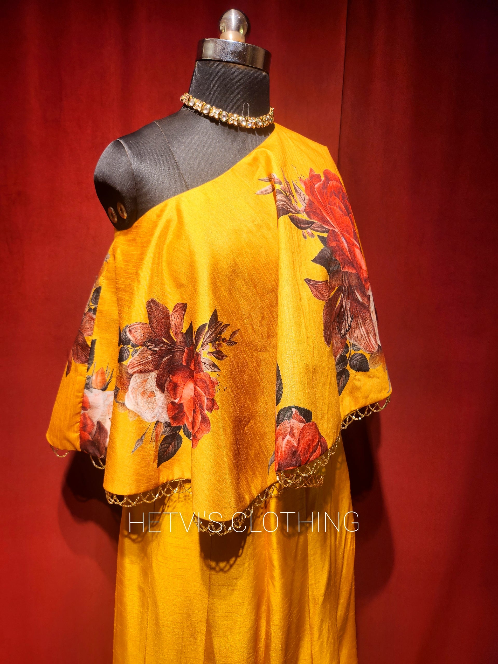 Yellow printed one shoulder cape and flared pants