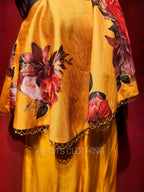 Yellow printed one shoulder cape and flared pants