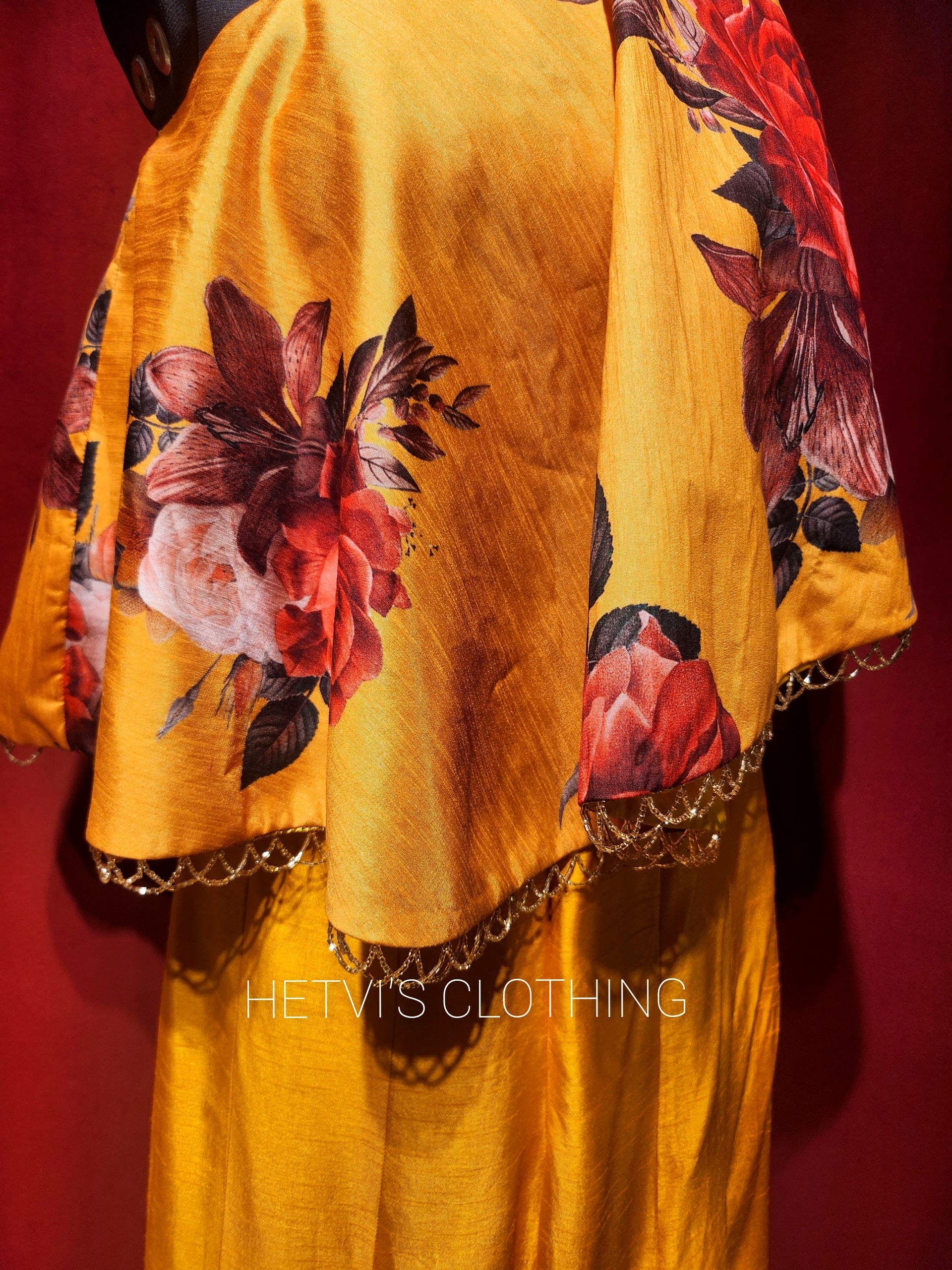 Yellow printed one shoulder cape and flared pants