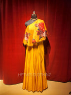 Yellow printed one shoulder cape and flared pants